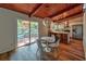 Modern kitchen with island, stainless steel appliances, and a dining area with natural light at 3348 Lynnray Dr, Atlanta, GA 30340