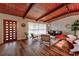 Spacious living room with wood floors, a modern door, and comfortable seating areas at 3348 Lynnray Dr, Atlanta, GA 30340