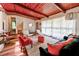 Open living room featuring wood-paneled ceilings and large windows, filled with natural light at 3348 Lynnray Dr, Atlanta, GA 30340
