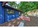 Private back patio of unique blue home providing a relaxing outdoor space for entertaining at 3348 Lynnray Dr, Atlanta, GA 30340
