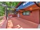 Inviting patio with brick accents, covered pergola, and comfortable seating area at 3348 Lynnray Dr, Atlanta, GA 30340