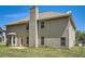 Backyard view showcases the home's siding, patio, and well-maintained lawn at 349 Pennant Ln, Fairburn, GA 30213