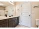 Bathroom with a large mirror, marble countertop, and a shower-tub combo at 349 Pennant Ln, Fairburn, GA 30213