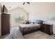 Bedroom features a ceiling fan, vaulted ceiling, and a comfortable bed at 349 Pennant Ln, Fairburn, GA 30213