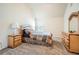 Bright bedroom with sloped ceilings features neutral carpet and a comfortable bed at 349 Pennant Ln, Fairburn, GA 30213
