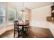 Cozy breakfast nook with natural light, hardwood flooring, and window seating at 349 Pennant Ln, Fairburn, GA 30213