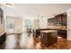 Spacious kitchen with granite counters, island, stainless steel appliances, and hardwood floors at 349 Pennant Ln, Fairburn, GA 30213