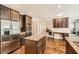 Modern kitchen with granite countertops, stainless steel appliances, and hardwood floors at 349 Pennant Ln, Fairburn, GA 30213