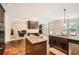 Open kitchen with island, granite counters, stainless steel appliances, and hardwood floors at 349 Pennant Ln, Fairburn, GA 30213