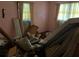 Bedroom with clutter and pink walls at 5804 S South Gordon Sw Rd, Austell, GA 30168