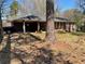 Traditional one-story brick home with a covered carport and mature trees at 5804 S South Gordon Sw Rd, Austell, GA 30168