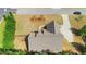 Aerial view of a home with large roof, long driveway, and mature trees at 20 Saddle Wood Dr, Dallas, GA 30157