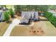 Aerial view of a home with large front yard, long driveway, and mature trees at 20 Saddle Wood Dr, Dallas, GA 30157