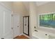 Bathroom featuring a soaking tub and tiled shower, with a window allowing natural light at 20 Saddle Wood Dr, Dallas, GA 30157