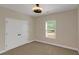 Bright bedroom with neutral carpet, large closet, and a window at 20 Saddle Wood Dr, Dallas, GA 30157