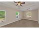 Bright bedroom with tray ceiling, large windows providing natural light, and neutral walls at 20 Saddle Wood Dr, Dallas, GA 30157
