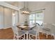 Cozy dining area with a stylish light fixture and natural light from a nearby window at 20 Saddle Wood Dr, Dallas, GA 30157