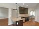 Modern kitchen featuring granite countertops, wood cabinets, and stainless steel appliances at 20 Saddle Wood Dr, Dallas, GA 30157