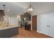 Modern kitchen featuring granite countertops, stainless steel appliances, and dark wood cabinetry at 20 Saddle Wood Dr, Dallas, GA 30157