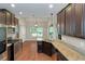 Well-lit kitchen with stainless steel appliances, granite countertops, and ample cabinet space at 20 Saddle Wood Dr, Dallas, GA 30157