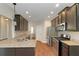 Stylish kitchen with stainless steel appliances, granite counters, and dark cabinets at 20 Saddle Wood Dr, Dallas, GA 30157
