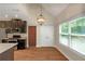 Bright kitchen with stainless steel appliances, granite counters, and a view to the backyard at 20 Saddle Wood Dr, Dallas, GA 30157