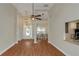 Spacious living room with high ceilings, hardwood floors, and an open view to the dining area at 20 Saddle Wood Dr, Dallas, GA 30157