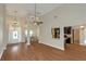 Bright living room with wood floors, open layout, and direct access to the adjacent kitchen at 20 Saddle Wood Dr, Dallas, GA 30157