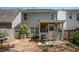 Back exterior featuring a screen porch, patio area, and level yard space, perfect for outdoor entertaining at 30 Crestfield Cir, Covington, GA 30016