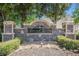 Stone community entrance sign for Fairview Estates surrounded by manicured landscaping and greenery at 30 Crestfield Cir, Covington, GA 30016