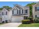 Charming home featuring a two-car garage, neat landscaping, and classic architectural details at 30 Crestfield Cir, Covington, GA 30016