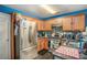 Functional kitchen with stainless steel appliances, wooden cabinets, and granite countertops at 30 Crestfield Cir, Covington, GA 30016