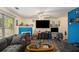 Spacious living room with large windows, a fireplace, and a cozy seating area at 30 Crestfield Cir, Covington, GA 30016