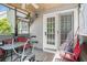Covered outdoor patio with red chairs at 30 Crestfield Cir, Covington, GA 30016