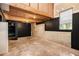Unfinished basement with exposed beams, concrete walls, and a small window at 314 Sable Trace Pass, Acworth, GA 30102