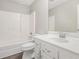 Bright bathroom features a single sink vanity with cabinets, mirror, and tub with shower at 314 Sable Trace Pass, Acworth, GA 30102