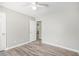 Bedroom with wood flooring and white trim, bathed in natural light from an open doorway at 314 Sable Trace Pass, Acworth, GA 30102