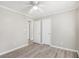 Bedroom featuring neutral paint, fan, trim molding, and luxury vinyl flooring at 314 Sable Trace Pass, Acworth, GA 30102