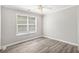 Simple bedroom with a fan, large window with blinds, and base molding at 314 Sable Trace Pass, Acworth, GA 30102