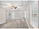 Large living space showcasing wood-look floors, a window, recessed lights, and multiple doorways at 314 Sable Trace Pass, Acworth, GA 30102