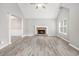 Bright living room featuring a cathedral ceiling, fireplace, and luxury vinyl flooring at 314 Sable Trace Pass, Acworth, GA 30102