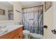 Bathroom with a vanity and a shower featuring a barn-style curtain rod at 3541 Haddon Hall Dr, Buford, GA 30519