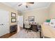 Home office with hardwood floors, ample natural light, and built-in shelving for an organized workspace at 3541 Haddon Hall Dr, Buford, GA 30519