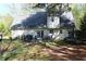 Rear view of the home showing backyard, deck, and lawn at 4314 Saddlecreek Ct, Auburn, GA 30011