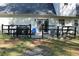 Fenced backyard with a patio, grill and seating at 4314 Saddlecreek Ct, Auburn, GA 30011