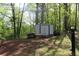 Landscaped backyard with storage shed at 4314 Saddlecreek Ct, Auburn, GA 30011