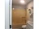 Bathroom featuring a tub with shower, marble countertop vanity, and modern fixtures at 4314 Saddlecreek Ct, Auburn, GA 30011