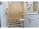 Bathroom featuring a tub with shower, marble countertop vanity, and modern fixtures at 4314 Saddlecreek Ct, Auburn, GA 30011