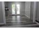 Light-filled dining area with modern flooring and access to the outdoors at 4314 Saddlecreek Ct, Auburn, GA 30011