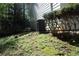View of the side yard featuring lawn and some bushes, next to the exterior of the home at 4314 Saddlecreek Ct, Auburn, GA 30011